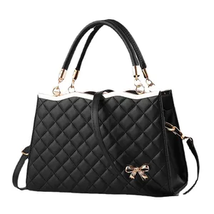 Sac à main bandoulière matelassé noir avec nœud doré et bandoulière amovible femme