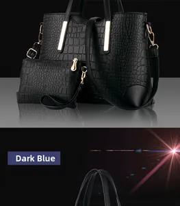 Detailed macro view of dark blue crocodile pattern leather texture with gold hardware