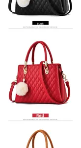 Close-up of quilted leather handbags in red and black with pearl fur ball charms
