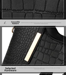 Detail of premium crocodile pattern leather and polished gold metal buckle on a black tote