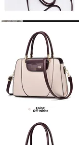 Detailed macro view of beige faux leather texture and elegant wine red handle on crossbody bag