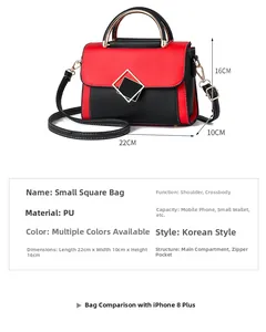 Detailed view of red and black PU leather crossbody bag with geometric metal buckle and handle