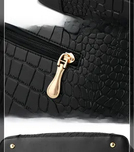 Detail of black crocodile texture handbag with golden base studs and smooth zipper