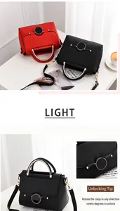 Detail of red and black leather handbags featuring round metal locks and U-shaped handles