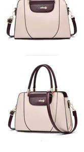 Detail view of two-tone handbag showing gold twist-lock closure and leather texture