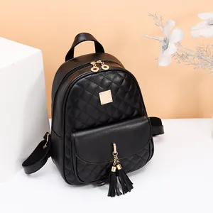Fashionable black quilted PU leather backpack with gold hardware and tassel accents
