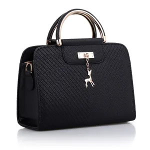 Classic black PU leather handbag with gold ring handles and cute deer pendant detail