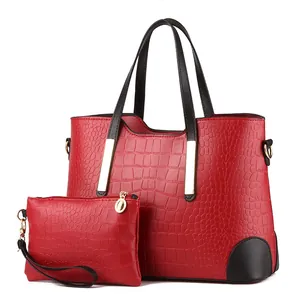 Red crocodile embossed tote bag and small pouch set with black handles and gold hardware