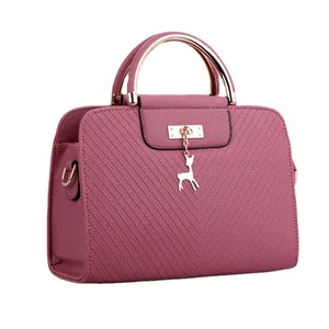 Deep pink quilted tote bag with silver handle and deer pendant for elegant women
