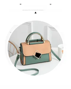 Close-up of vintage-style patchwork PU leather handbag with elegant golden geometric lock
