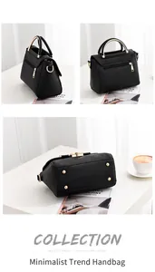 Detail view of black matte handbag showing gold circular handle, base studs and side stitching