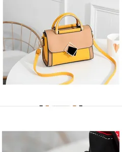 Close-up of color-block PU leather handbag with metallic handle and square clasp