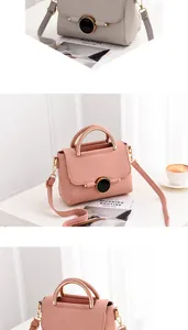 Detailed macro view of litchi textured leather handbag in elegant grey and soft pink colors