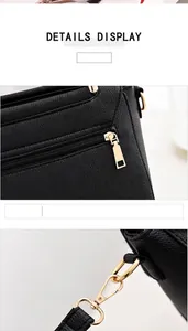 Close-up of bright gold zipper and strap hardware on black litchi grain leather handbag