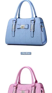 Detailed close-up of sky blue and pink handbags with geometric pattern and bow decoration