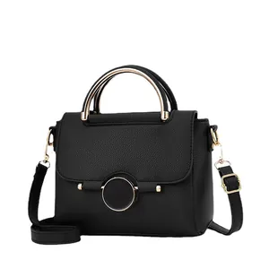 Elegant black lychee grain leather handbag with gold handle and round metal buckle