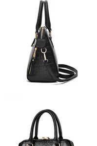 Dettagli della borsa tote nera in ecopelle con texture a coccodrillo e oro metallo