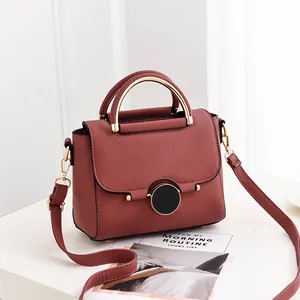 Chic berry red berry handbag with lychee grain leather and golden metal handle