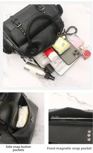 Detail view of black Boston bag interior capacity and magnetic snap button closures