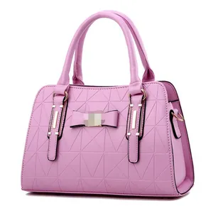 Pink geometric quilted handbag for women with bow detail and gold-tone hardware