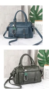 Detailed view of high-quality Boston handbag with star charms and studded flap pockets