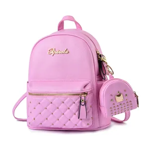 Pink mini faux leather backpack set with studded quilting and gold-tone metal hardware