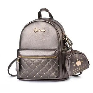 Fashionable studded bronze quilted backpack with matching mini coin purse and metal logo