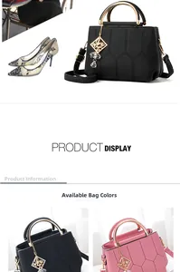 Detail of stitched crossbody bag with gold ring handle and diamond metal charm