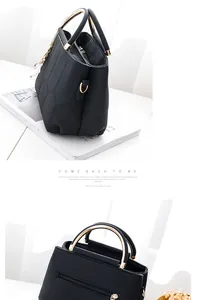 Detail of black crossbody bag featuring hexagonal quilting and golden metal ring handles