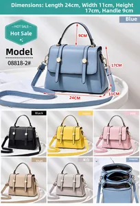 Internal view of fashion handbag showing zippered compartments and detailed storage space