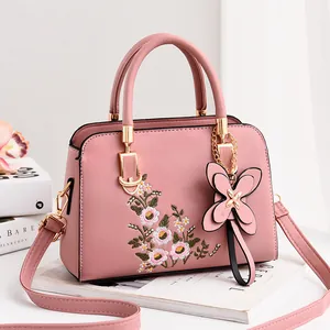 Pink PU leather handbag with floral embroidery and butterfly charm for women