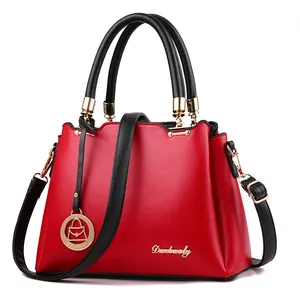 Fashionable red and black large capacity handbag with golden metal hardware detail
