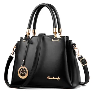 Large black leather tote bag with gold Danbaoly logo and adjustable shoulder strap