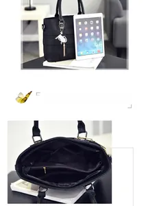Large black tote bag with interior compartments showing capacity for an iPad and essentials