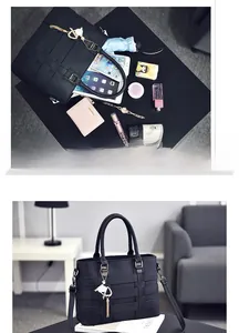 Spacious interior of black woven tote bag showing storage for tablet and essentials