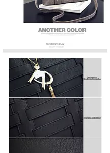 Detail of woven leather texture, gold hardware charm and precision stitching on handbag