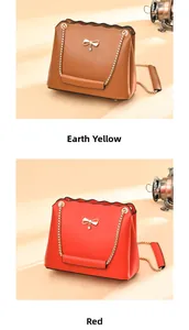 Detail view of stylish square bags with bow accent and chain strap in brown and red