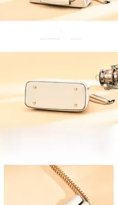 Detailed view of beige leather bag with gold chain strap and anti-wear bottom studs