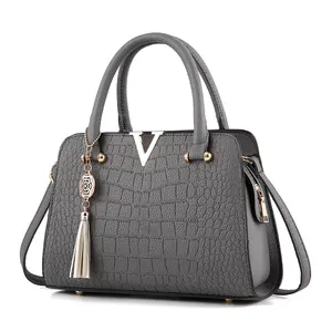 Classic dark grey handbag with crocodile texture and gold V-shaped metal buckle detail