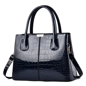 Deep blue embossed patent leather tote bag with crocodile texture and gold hardware