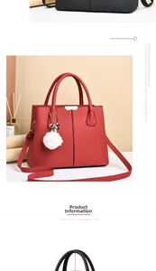 Détail du sac à main rouge en cuir grainé avec pompon en peluche et poignée de 12 cm
