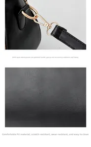 Detail of durable PU leather texture and gold plated hardware on black handbag