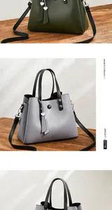 Detail of PU leather tote with magnetic closure and heart-shaped pendant attachment