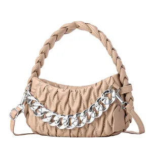 Beige woven handle handbag with V-quilted pleats and chunky silver chain decoration
