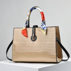 Chic beige crocodile embossed tote bag with colorful silk scarf handle and gold hardware