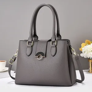Elegant dark grey textured leather handbag with gold hardware and top handle strap