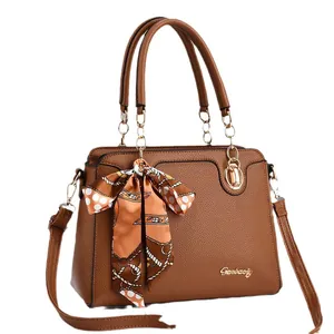 Brown lychee leather handbag with floral scarf and metallic logo for elegant women
