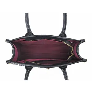 Top view of tote bag interior with multiple compartments and dark red fabric lining