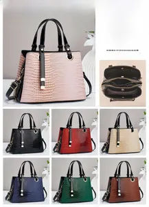 Detailed view of crocodile pattern PU leather bag showing internal pockets and multi-colors