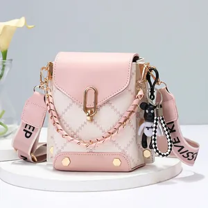 Minimalist crossbody phone bag in pink and cream PU leather with quilted stitching